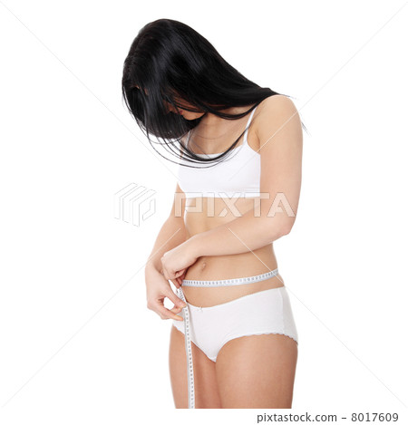 Sexy, young woman measuring her waist Sexy, young woman measuring her waist 8017609