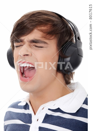 Young mans singing with headphones. Young mans singing with headphones. 8017615