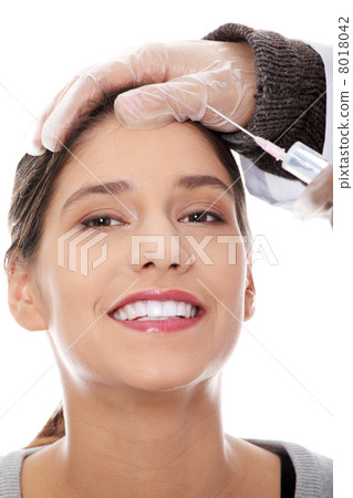 Plastic surgeons giving botox injection Plastic surgeons giving botox injection 8018042