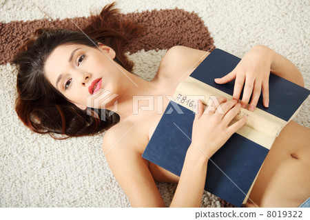 Beautiful topless woman with a book 8019322