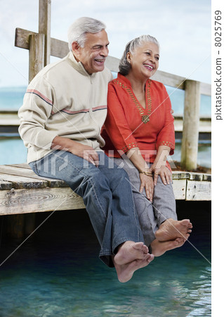 Old couple sitting together Old couple sitting together 8025769