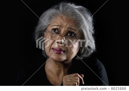 Portrait of an old woman with eye glasses 8025888