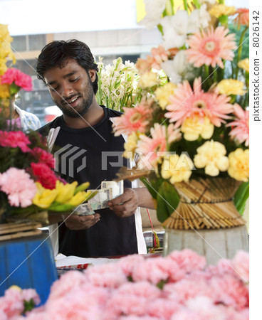 Florist counting his money 8026142