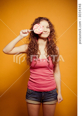 happy young woman with lollipop happy young woman with lollipop 8034348