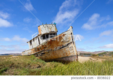 An abandoned old fishing boat 8036022