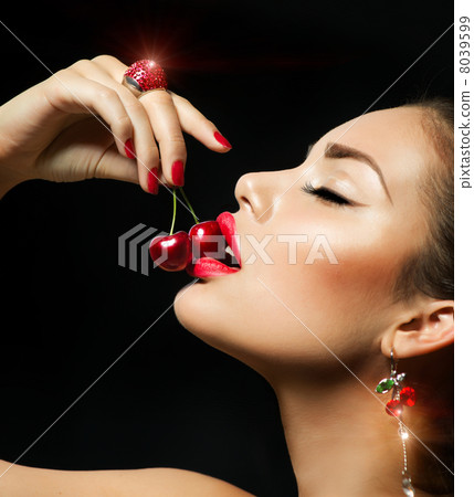 Sexy Woman Eating Cherry. Sensual red Lips with Cherries Sexy Woman Eating Cherry. Sensual red Lips with Cherries 8039599