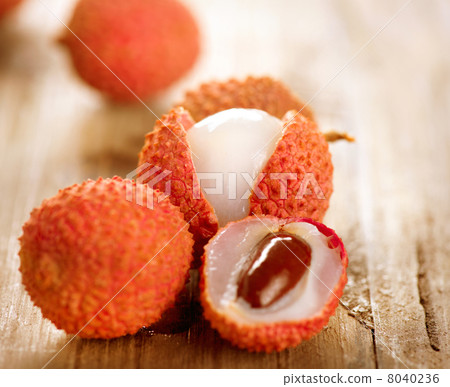 Lychee on a wooden table. Lichi Closeup. Selective focus Lychee on a wooden table. Lichi Closeup. Selective focus 8040236