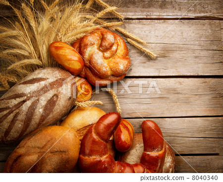 Bakery Bread and Sheaf over Wood Background Bakery Bread and Sheaf over Wood Background 8040340