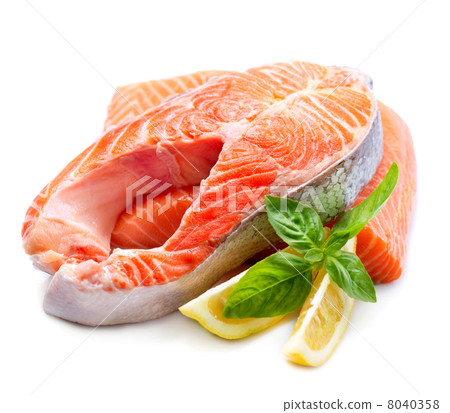Raw Salmon Red Fish Steak with Herbs and Lemon isolated on White 8040358
