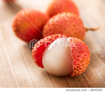 Lychee on a wooden table. Lichi Closeup. Selective focus Lychee on a wooden table. Lichi Closeup. Selective focus 8040361