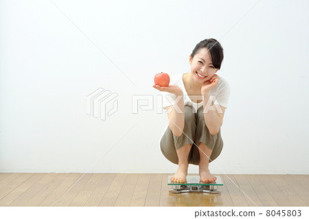 Girls riding a scale 8045803