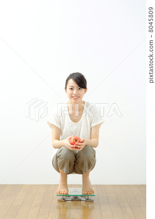 Girls riding a scale 8045809