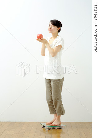 Girl riding a scale Girl riding a scale 8045812