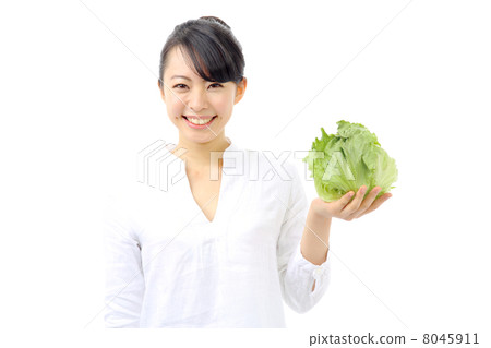 A woman with lettuce 8045911