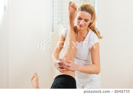 Patient at the physiotherapy doing physical therapy 8048735