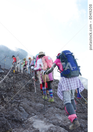 Image of tourists in a procession of a tour to climb Mt. Fuji Image of tourists in a procession of a tour to climb Mt. Fuji 8049208