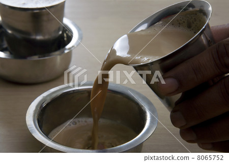 Filter coffee being poured into a dabarah Filter coffee being poured into a dabarah 8065752