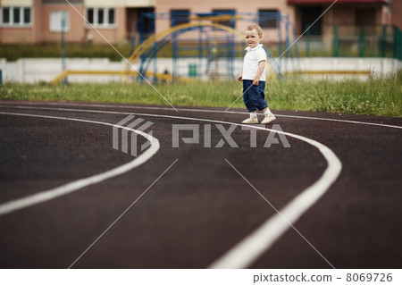 funny children playing on stadium 8069726