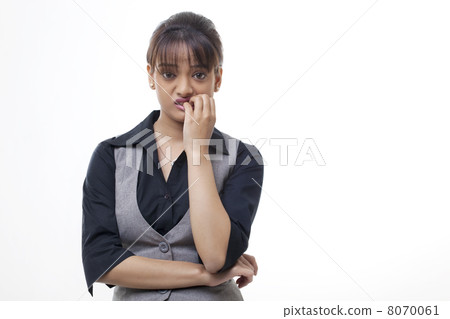 Businesswoman biting fingernails over white background Businesswoman biting fingernails over white background 8070061