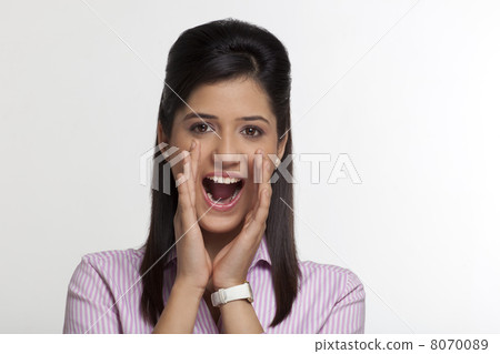 Portrait of female executive shouting 8070089