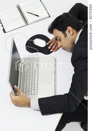 Businessman asleep at work Businessman asleep at work 8070360