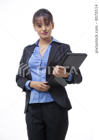 Portrait of beautiful young businesswoman holding laptop over white background Portrait of beautiful young businesswoman holding laptop over white background 8070514