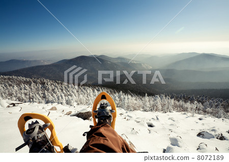 图库照片: hiker in winter mountains snowshoeing