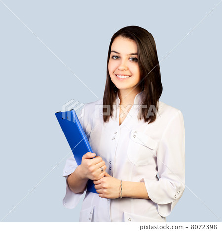 Smiling medical doctor woman with with clipboard. Isolated over Smiling medical doctor woman with with clipboard. Isolated over 8072398