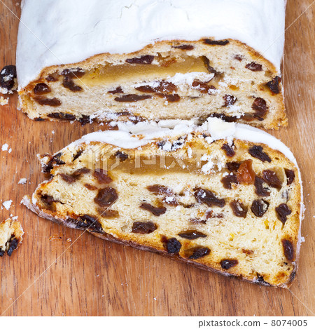 sliced Stollen cake with dried fruit and marzipan 8074005