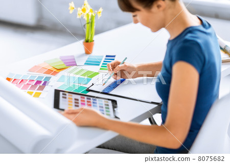 woman working with color samples for selection 8075682
