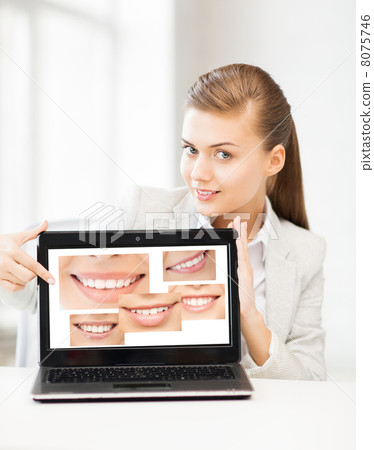 woman with laptop and smiles woman with laptop and smiles 8075746