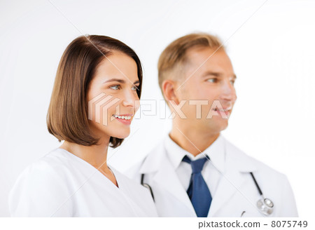 two doctors with stethoscopes 8075749