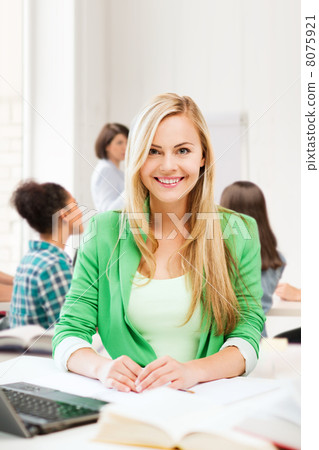 smiling student girl with laptop at school smiling student girl with laptop at school 8075921