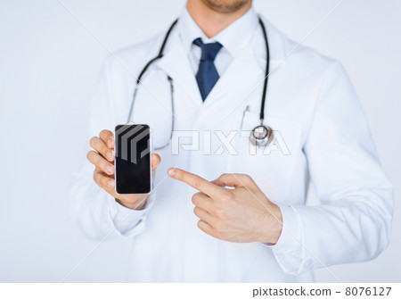 doctor pointing at smartphone doctor pointing at smartphone 8076127