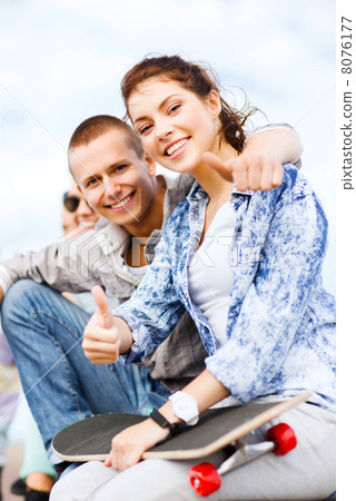 teenages with skateboard outside 8076177