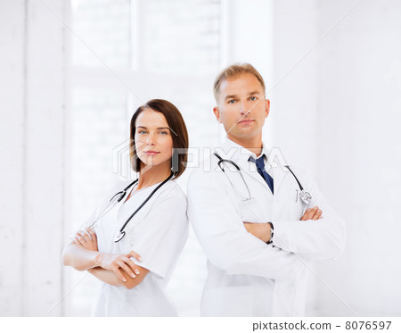 two doctors with stethoscopes 8076597