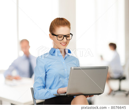 businesswoman with laptop computer at work 8076645