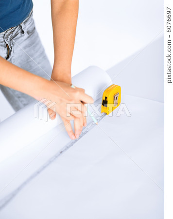 architect drawing on blueprint architect drawing on blueprint 8076697