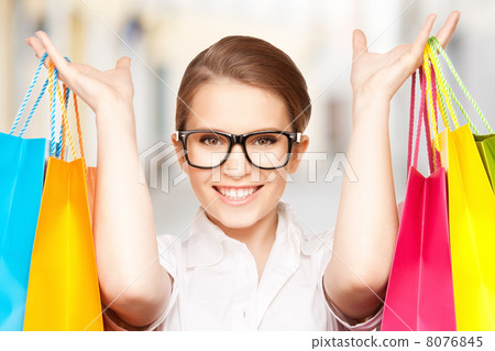 woman with shopping bags in ctiy woman with shopping bags in ctiy 8076845