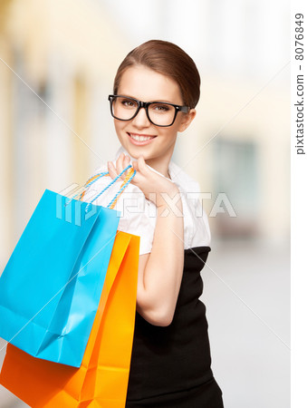 woman with shopping bags in ctiy woman with shopping bags in ctiy 8076849