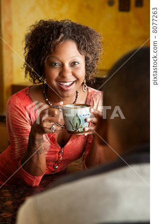 African-American woman and young man in kitchen African-American woman and young man in kitchen 8077263