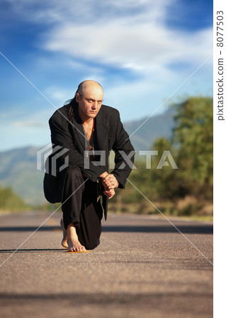 Indigenous man in the middle of a road 8077503