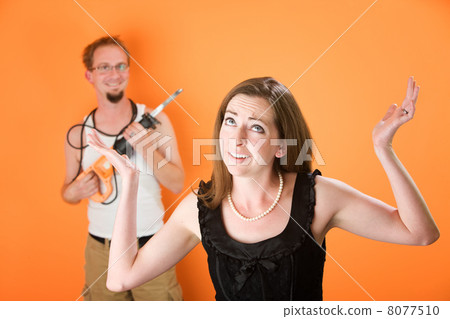 Frustrated woman and incompetent handyman 8077510