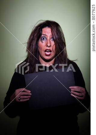 Talking woman taking a mugshot Talking woman taking a mugshot 8077625