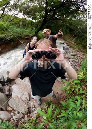 European and American couple with nature guide 8077801