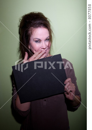 Woman snickering in mugshot Woman snickering in mugshot 8077858