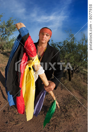 Native American man with colorful flags 8077938