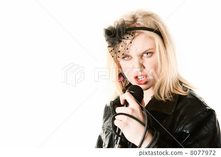 Pretty young singer or comedian with microphone Pretty young singer or comedian with microphone 8077972