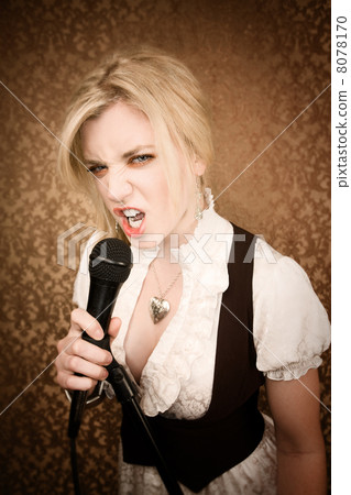 Pretty young singer or comedian with microphone Pretty young singer or comedian with microphone 8078170