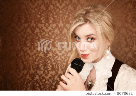 Pretty young singer or comedian with microphone 8078681